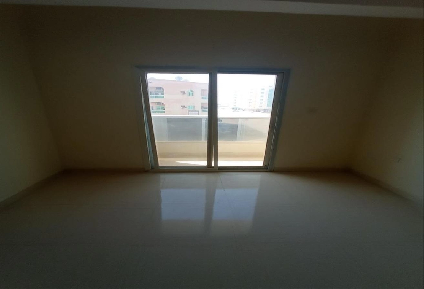 A room and a living room with a large balcony, easy access to Dubai