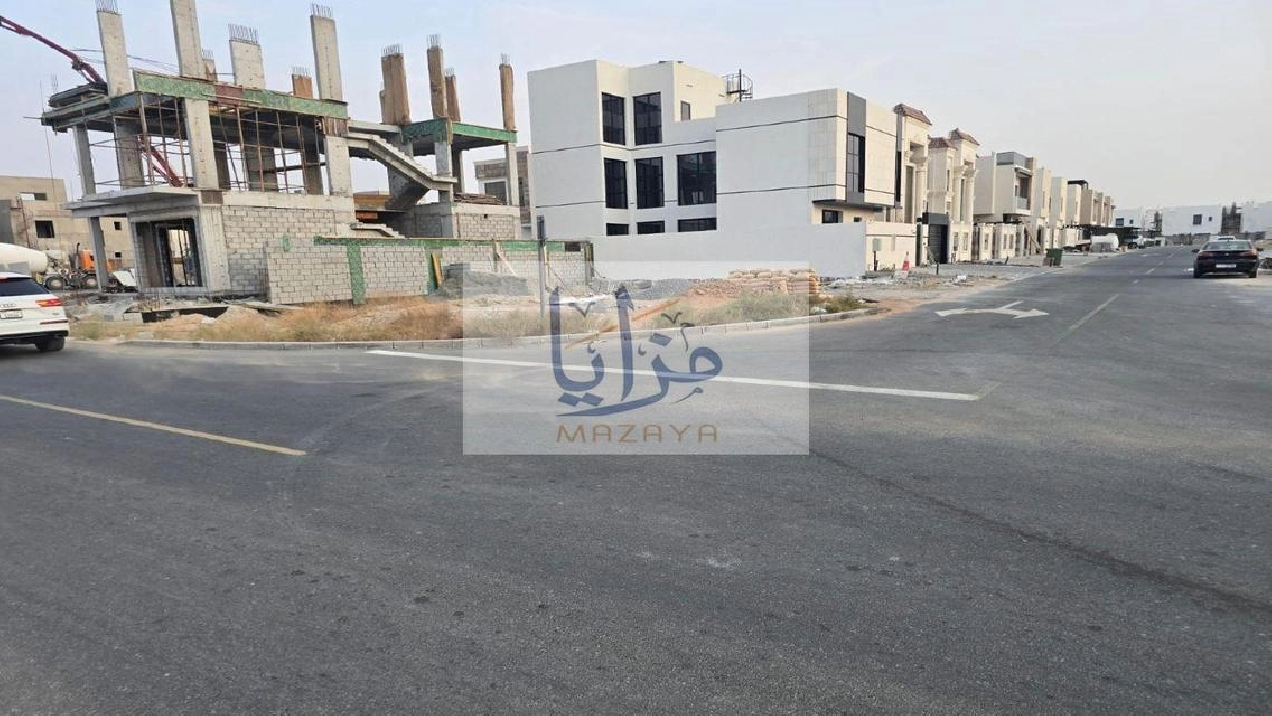 Residential land for sale on a corner lot with two Pictures